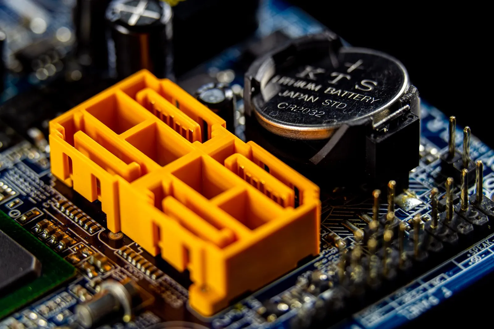 Macro of a graphics card heatsink lit in cool blue